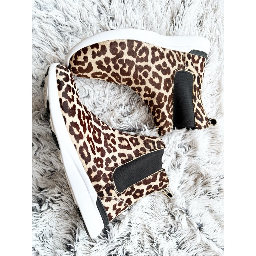 APL Leopard-Print Wedge Booties with Black Elastic Panels.